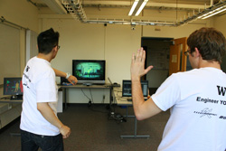 HCDESA students Brian Espinosa (left) and Chris Patterson demonstrate their Kinect skills during Engineering Discovery Days.