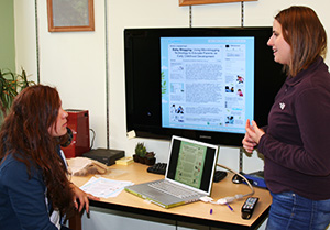 Professor Julie Kientz works with a student in her lab at the Human Centered Design and Engineering department.