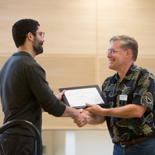 PhD student Daniel Perry receiving the 2015 HCDE Student Innovator Award