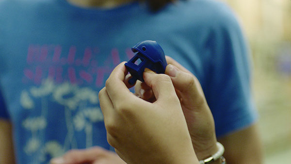 Hands holding 3-d printed object