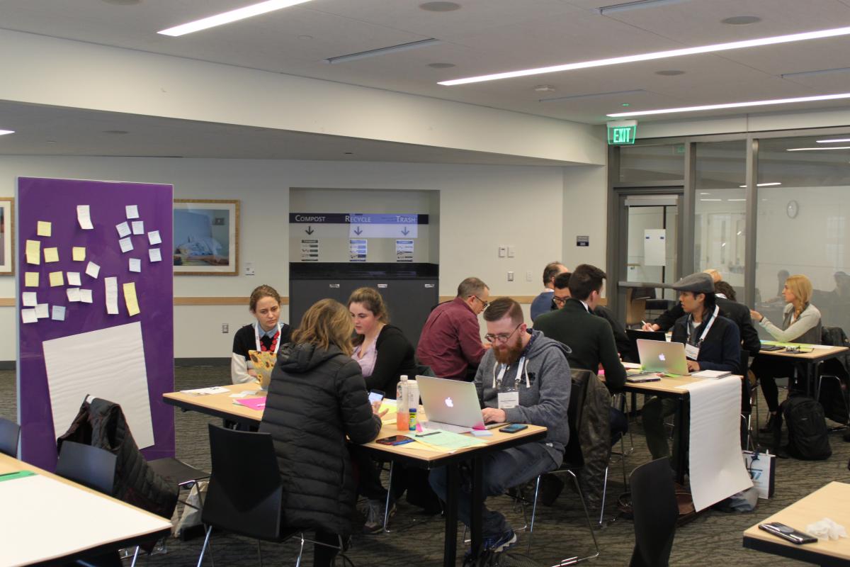 Attendees working around tables