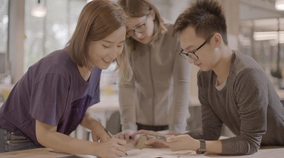 3 students working around a table