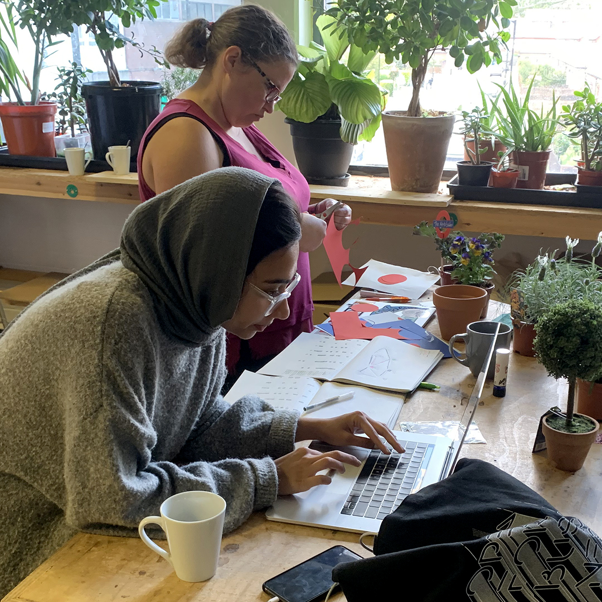 Student working on a laptop in the Greenlab