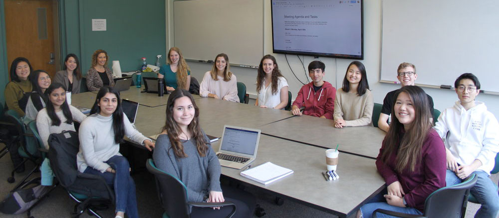 Students around a table in Sieg Hall