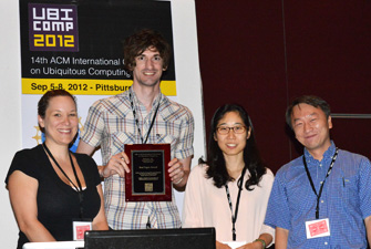 HCDE Professor Julie Kientz's graduate students Matthew Kay and Eun Kyoung Choe receive the Best Paper Award at the Ubicomp 2012 conference. From left: Program Committee Chair Gillian Hayes, UW CSE Graduate Student Matthew Kay, UW iSchool graduate student Eun Kyoung Choe, and Program Committe Chair Hao Chu. Photo: Hideyuki Tokuda