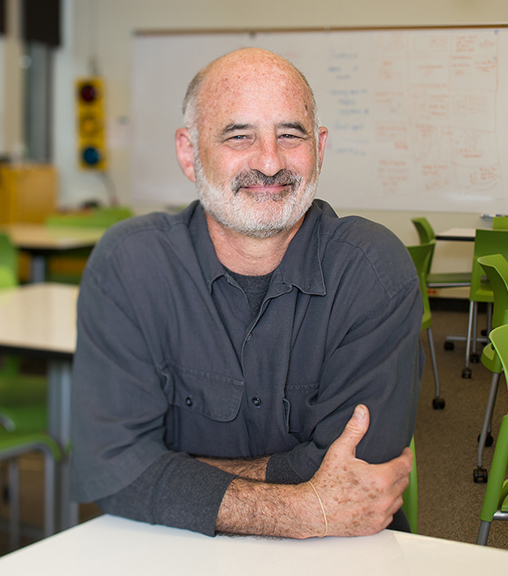 Andy Davidson seated in the HCDE Design Lab classroom