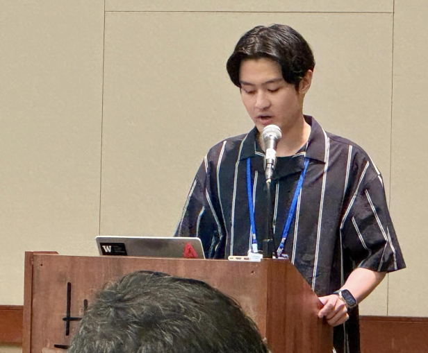 Student presenting behind a podium