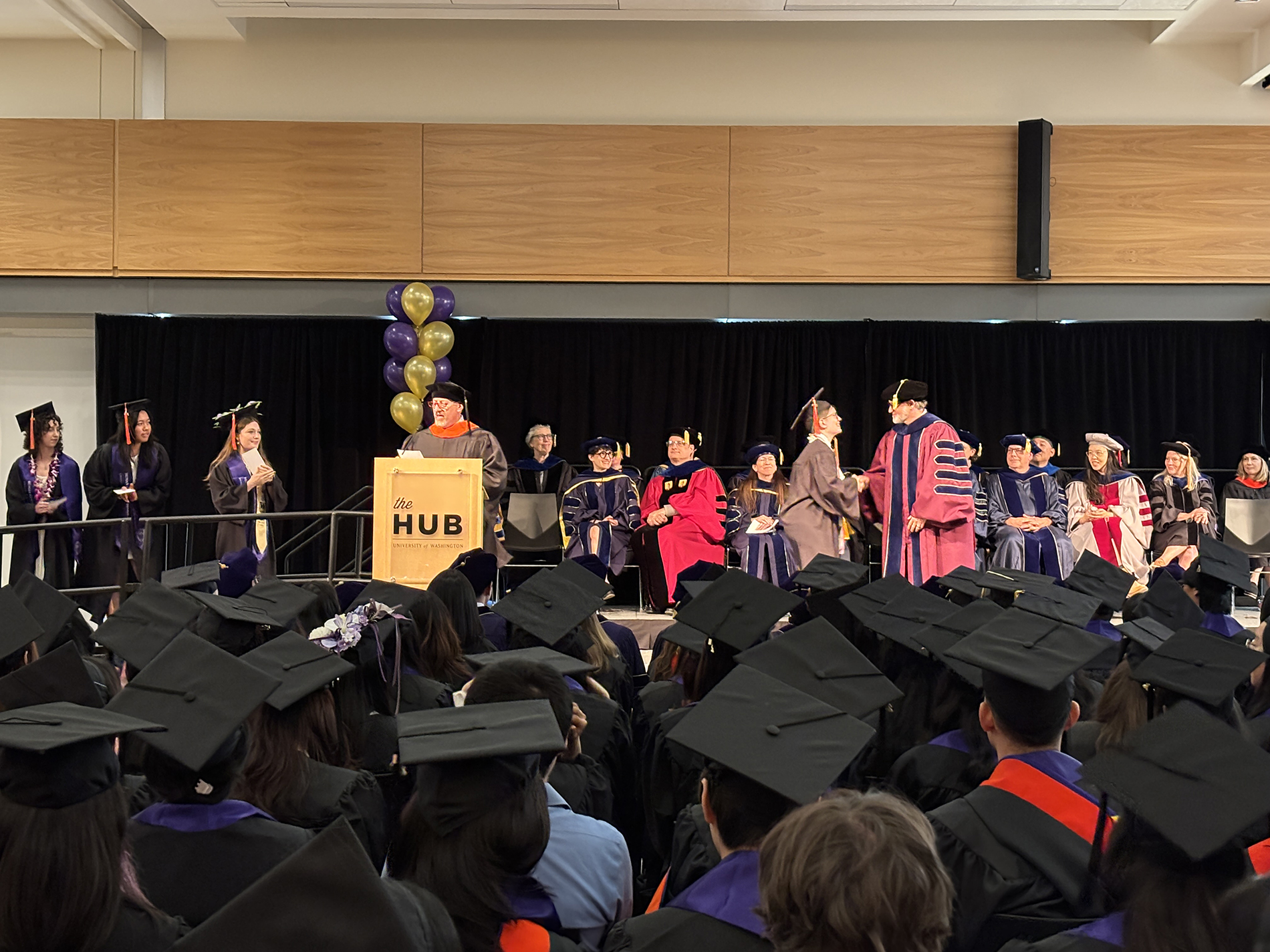 Students cross the stage