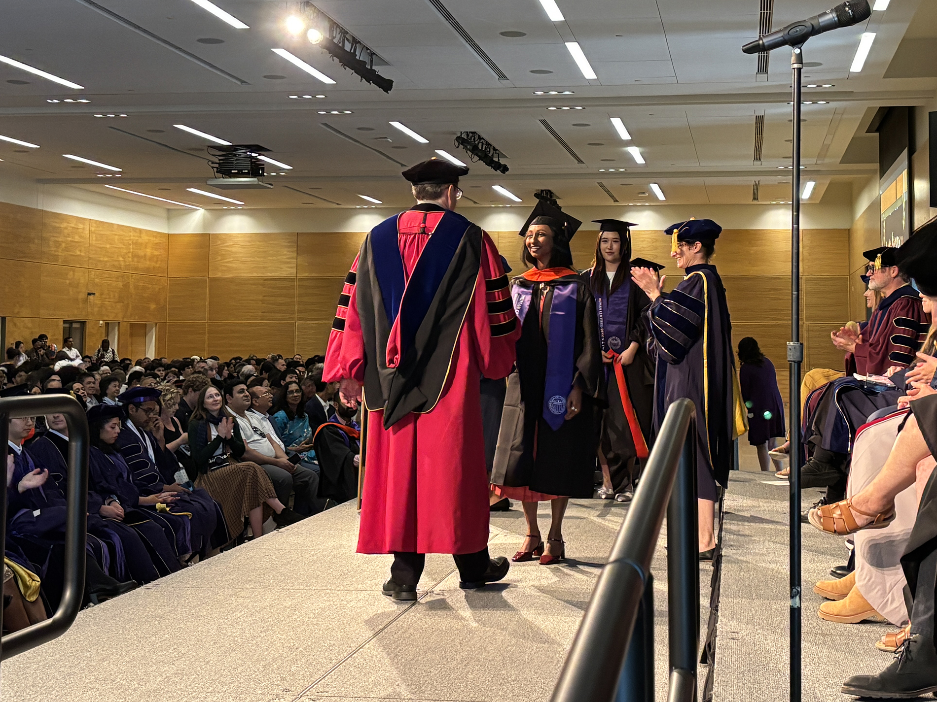 Students cross the stage