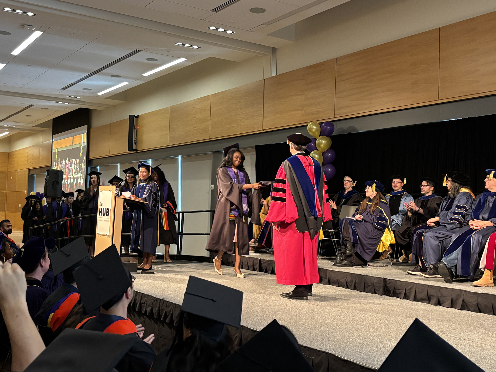 Students cross the stage