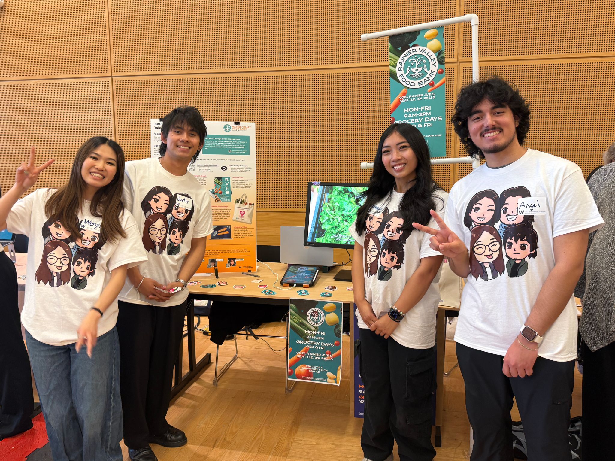 A team of students stand with their capstone display