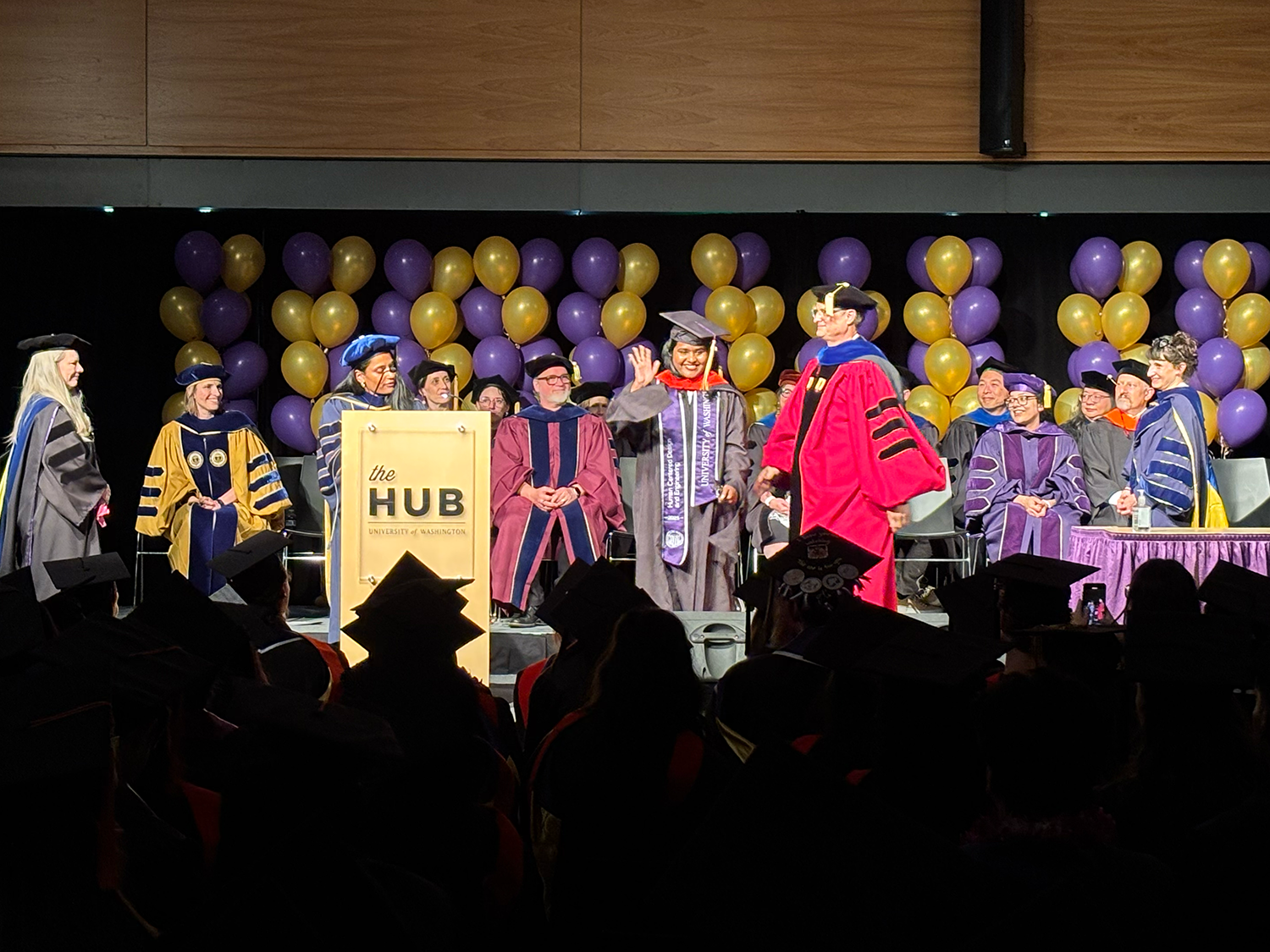Graduates crossing the stage
