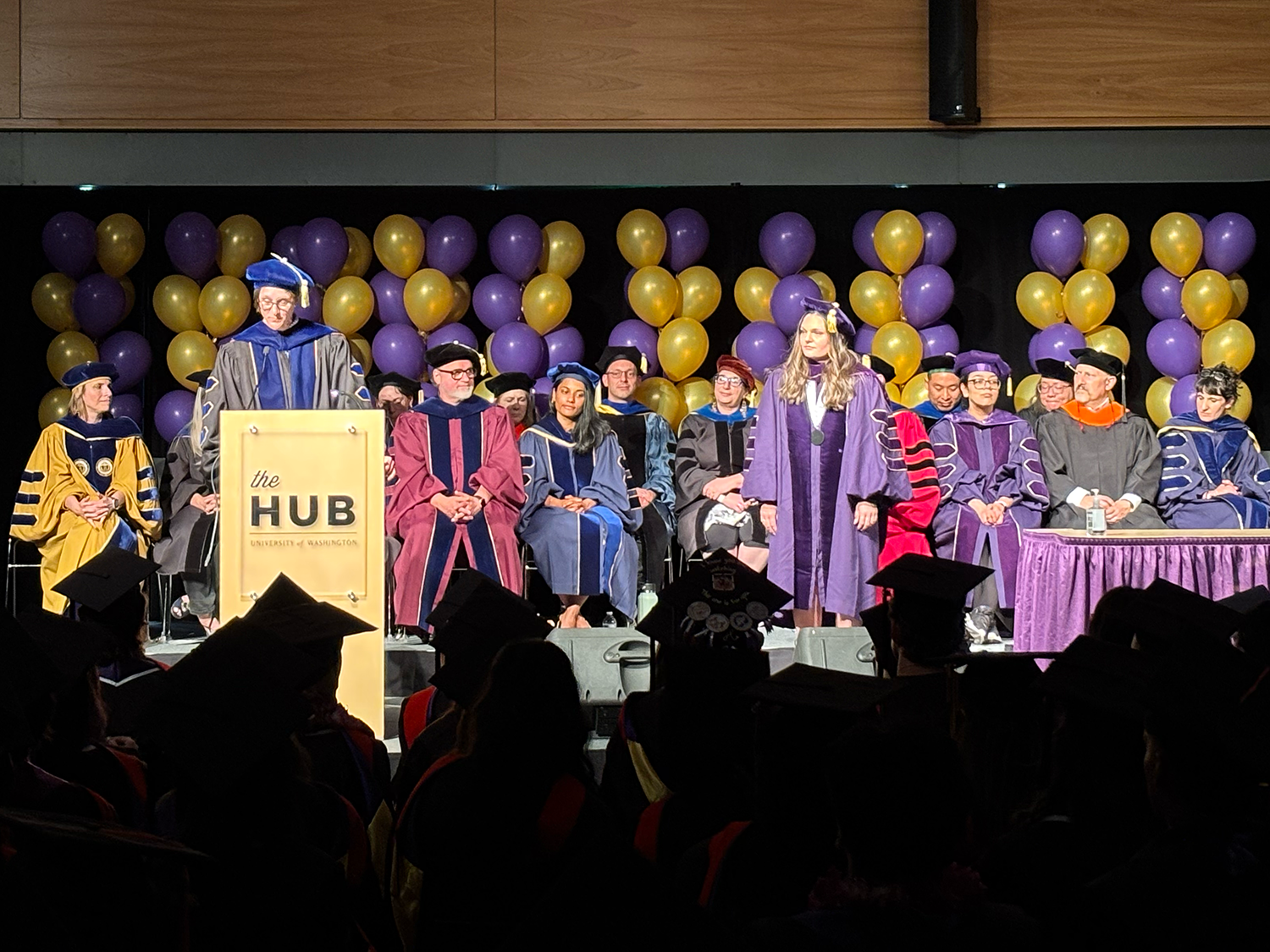 Graduates crossing the stage