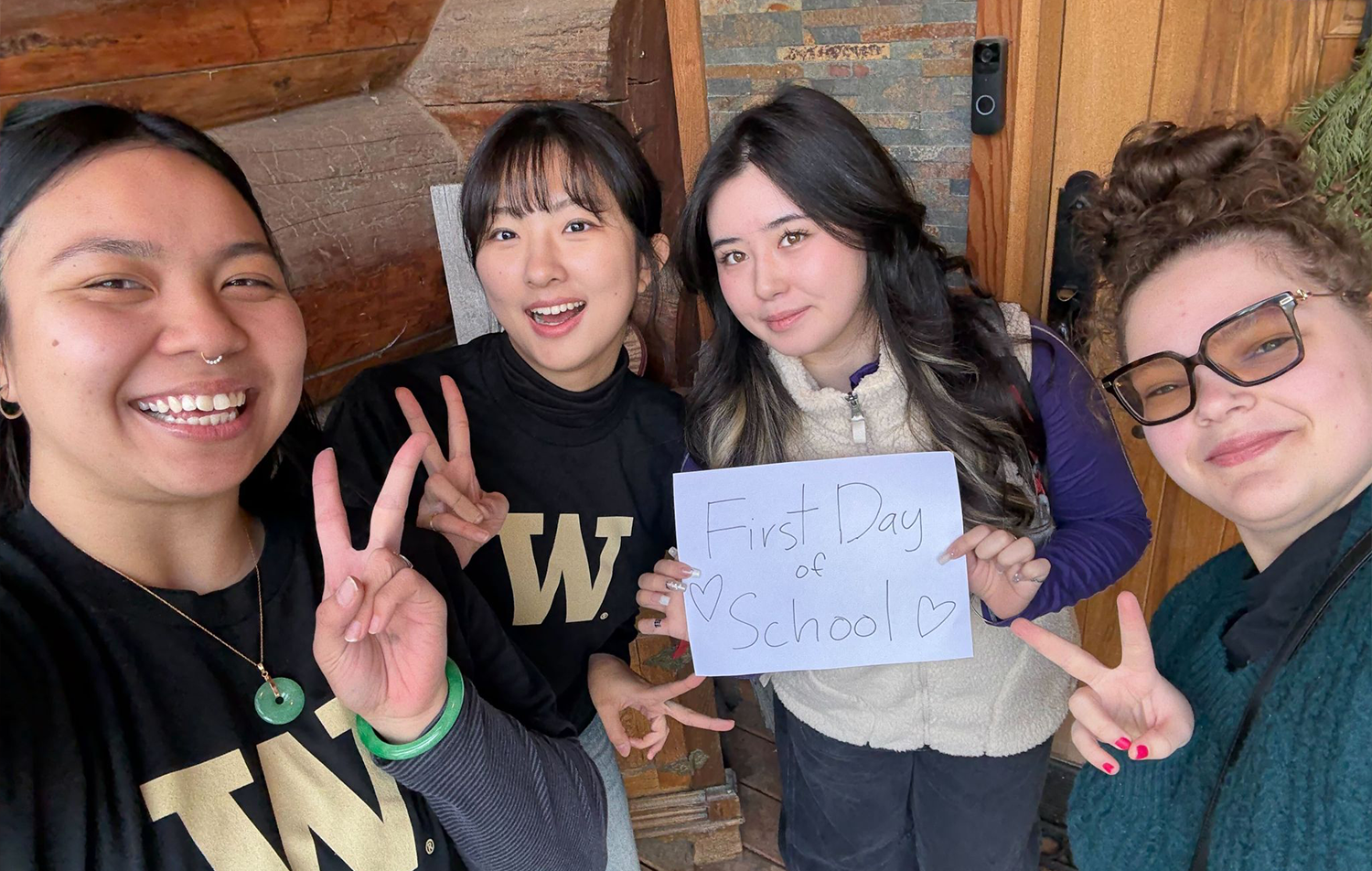 The HCDE student team pose with a handmade sign that says