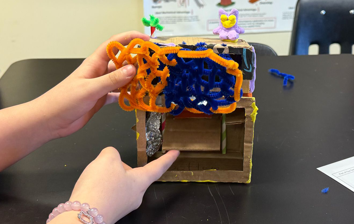 Up close of a cardboard prototype of a student idea