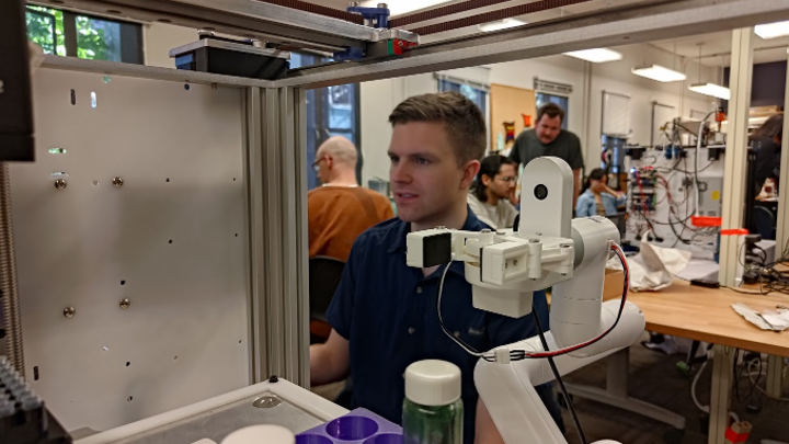 workshop participant operates a machine