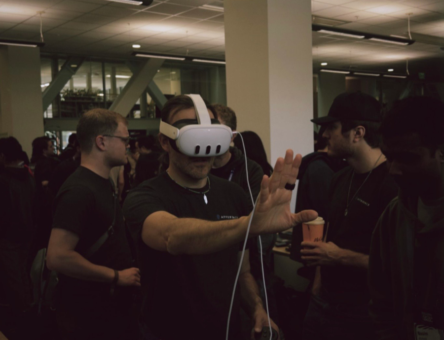 A person wears a VR headset with their arms outstretched.