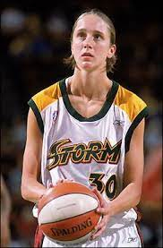 Kate Starbird holds a basketball in Seattle Storm uniform