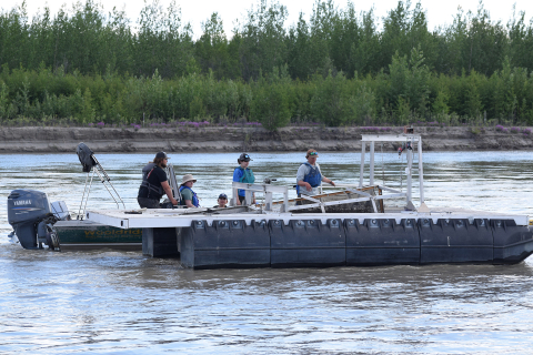 Four HCDE students on a research boat in Alaska