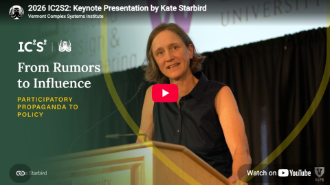 Kate Starbird stands at a podium during her talk