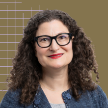 Laura Forlano's headshot over a gold background with a grid pattern.