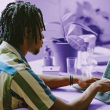 Man types on a laptop