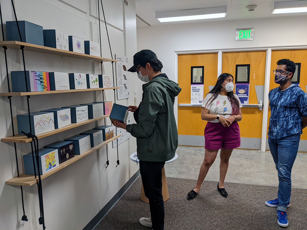 student interacting with exhibit