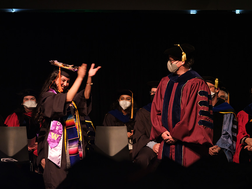 Student crossing the stage at graduation