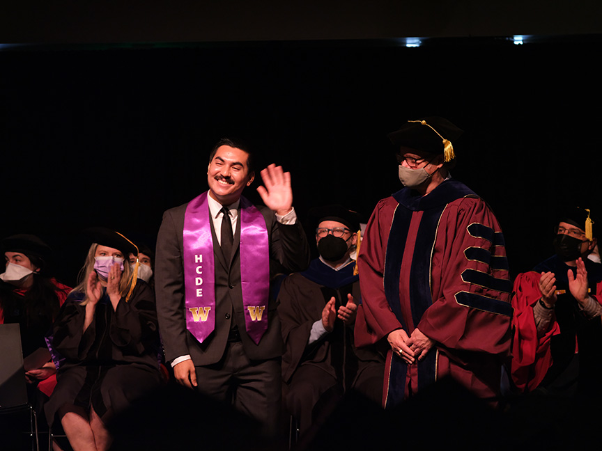 Student crossing the stage at graduation