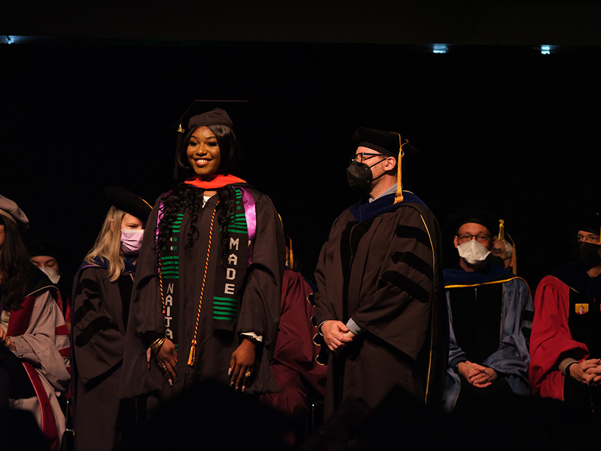 Student crossing the stage at graduation