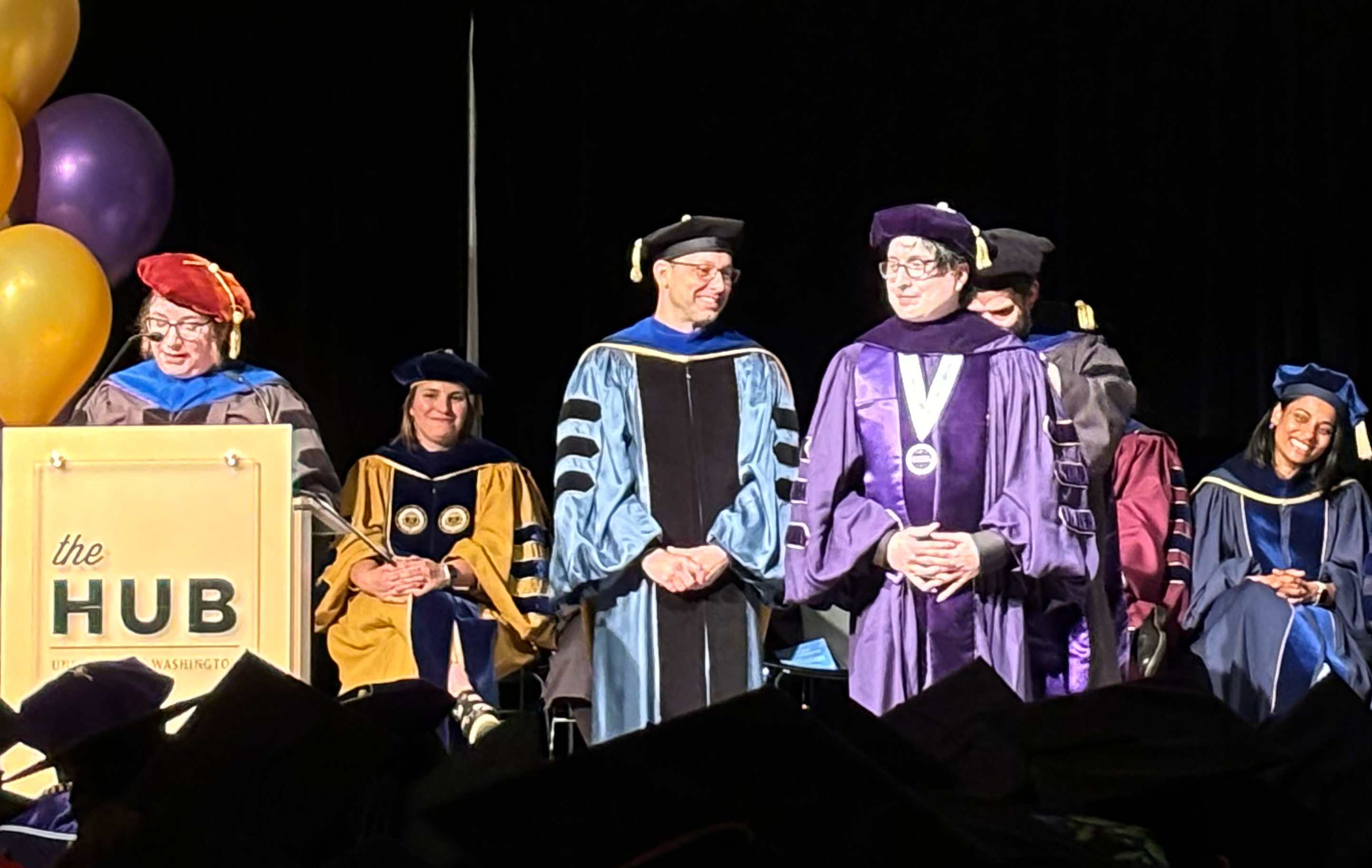 Graduates crossing the stage