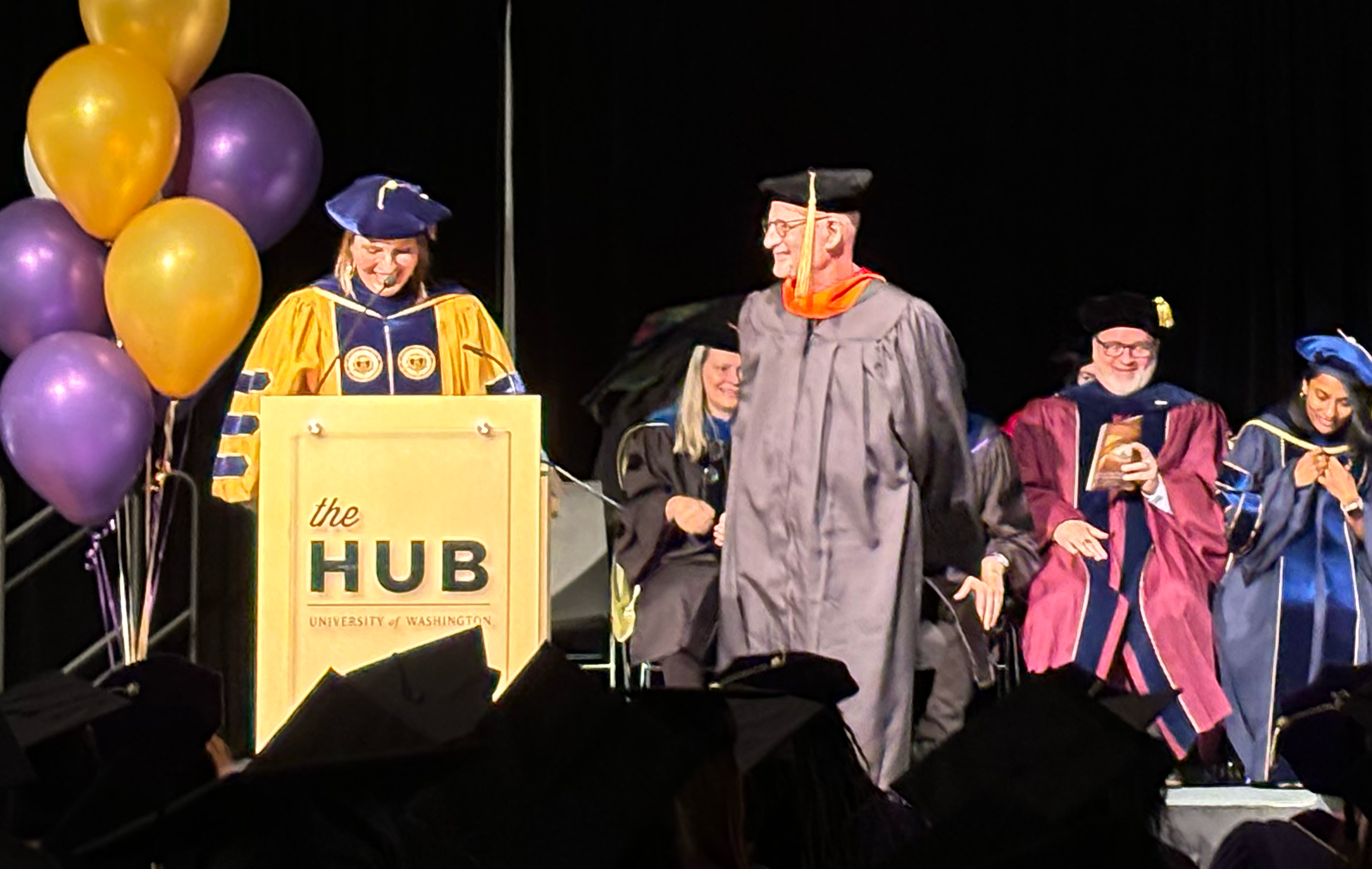 Andrew Davidson receiving Mikey Award from Julie Kientz on stage