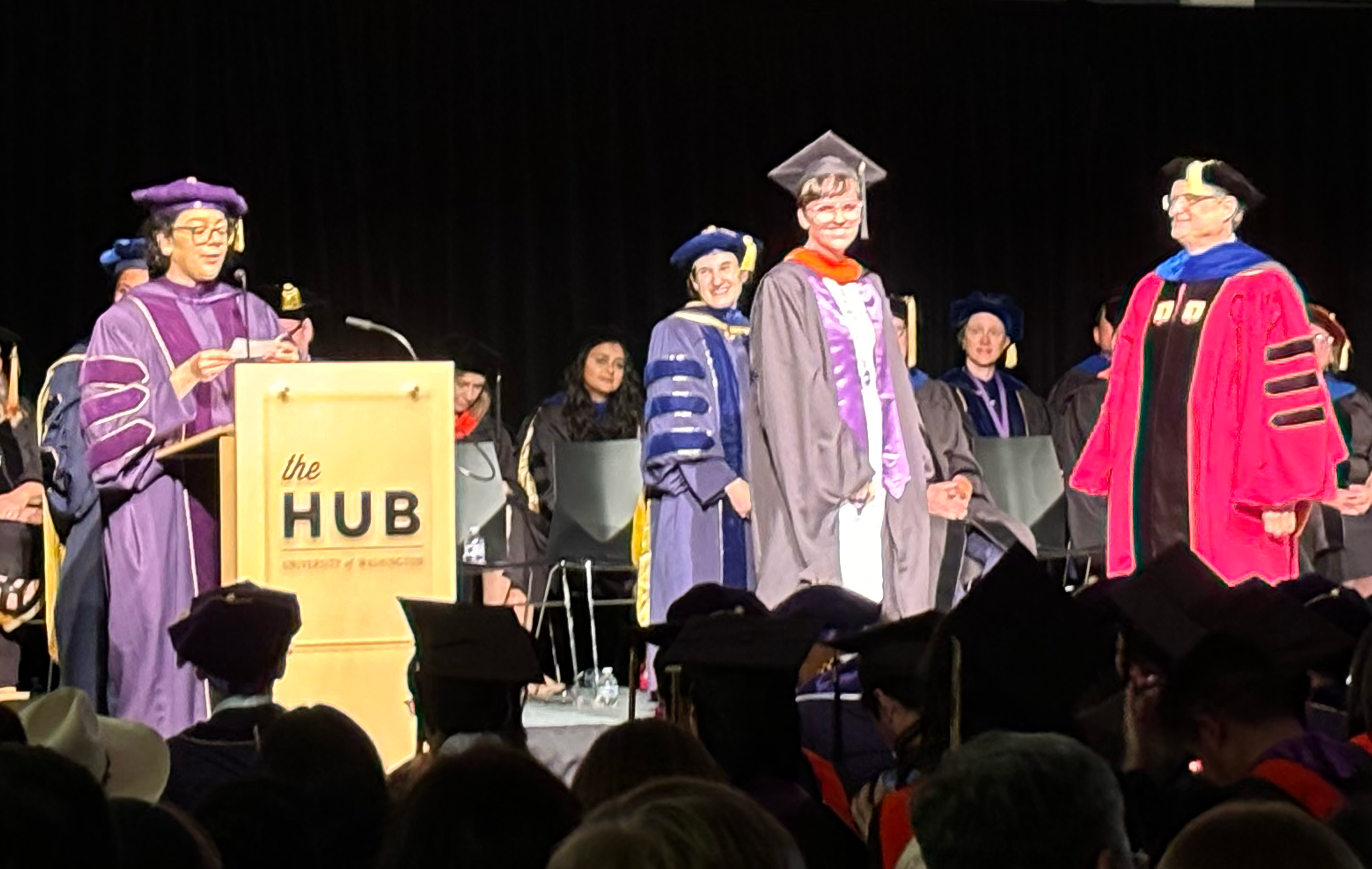 Graduates crossing the stage