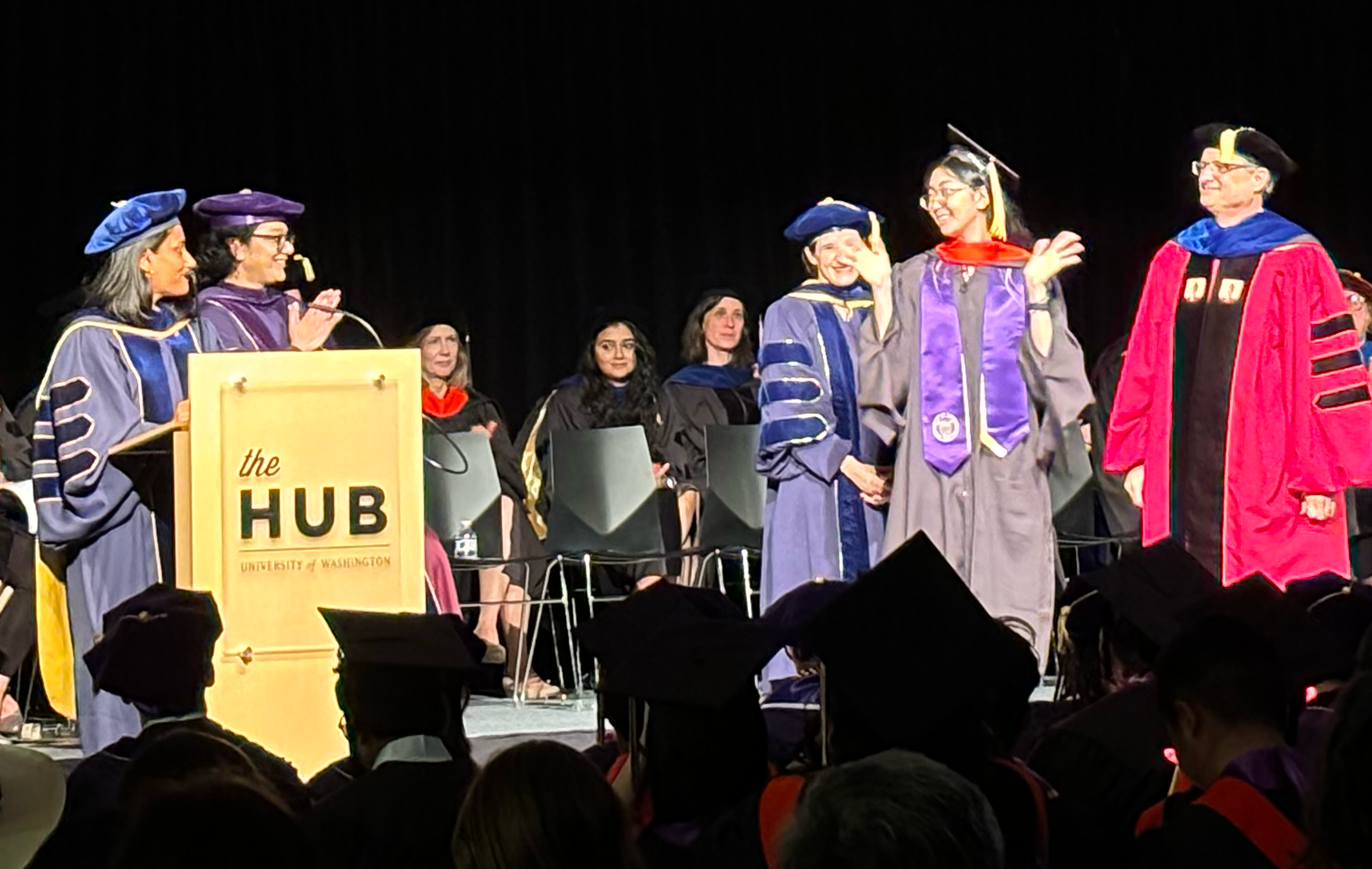 Graduates crossing the stage