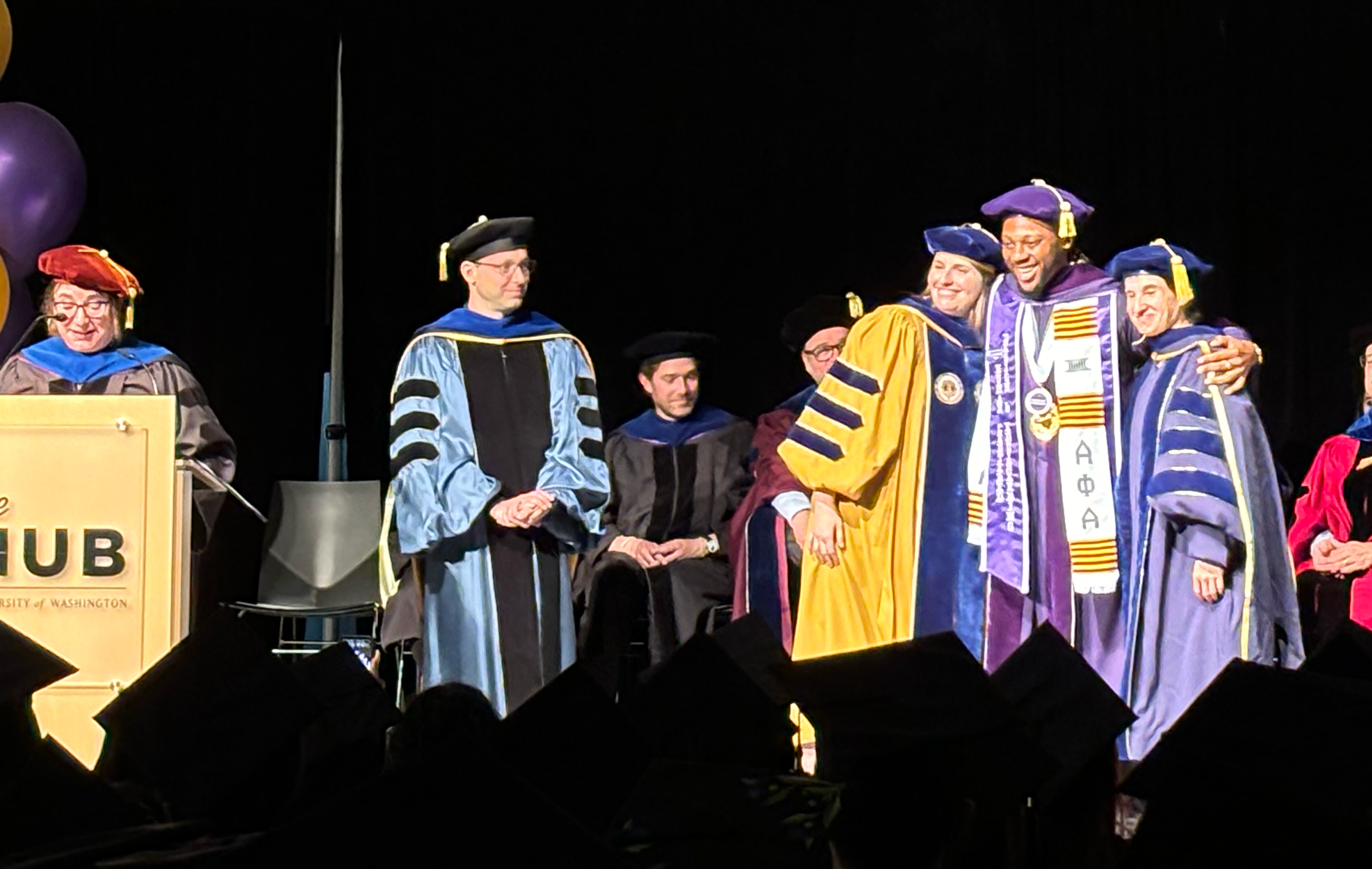 Graduates crossing the stage