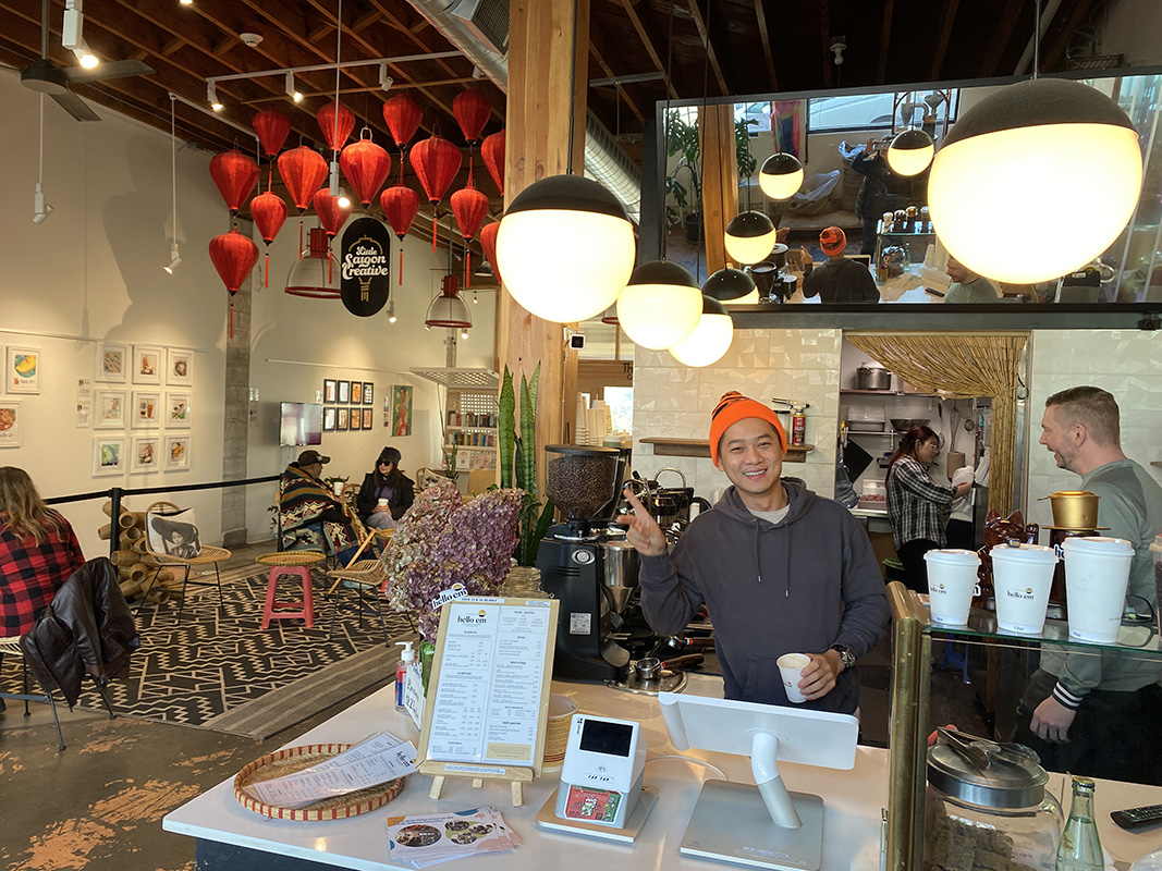 Employee behind the cafe cash register