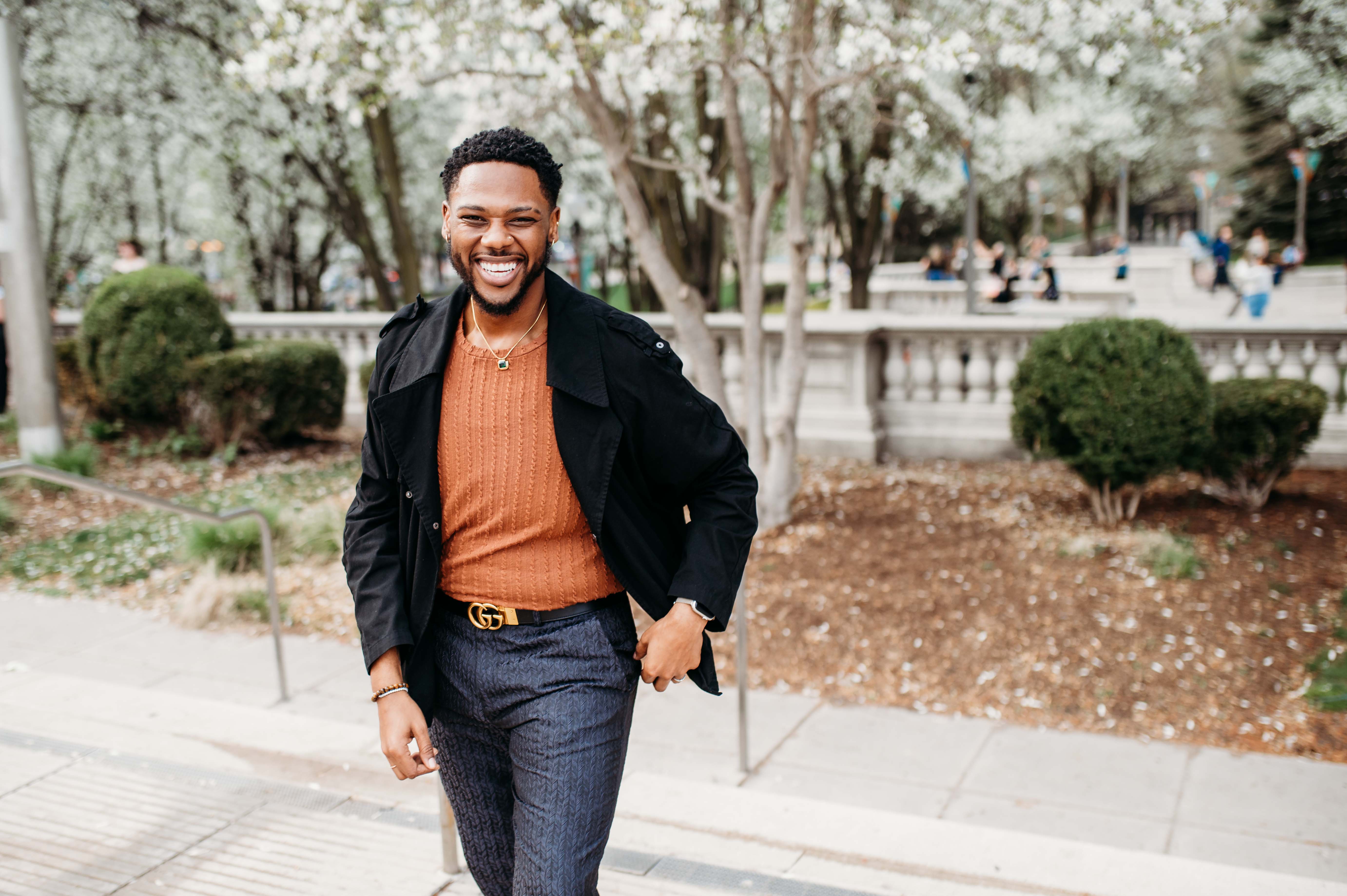 Jay Cunningham stands outside smiling at the camera