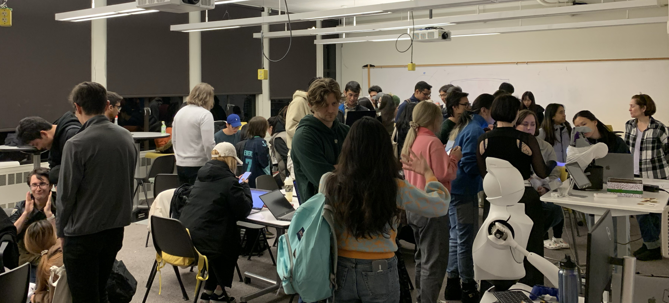 Classroom full of students and guests during the open showcase