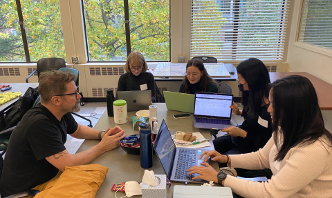 Students working around a table in Sieg Building